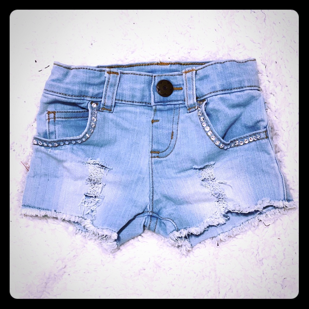 Girls custom distressed and jeweled shorts